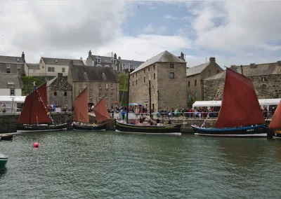 Old Harbour Portsoy at Scottish Traditional Boat Festival. Photo Credit - Allan Robertson