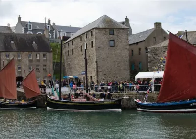 Old Harbour Portsoy at Scottish Traditional Boat Festival. Photo Credit - Allan Robertson